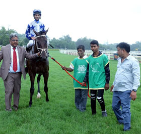 Trainer Prasanna Kumar leading in Royal Mysore (Trevor Patel up), winner of  Winfair 247 Gaming Trophy at Pune on Sunday.